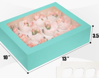 May include: A turquoise rectangular bakery box with a clear window, filled with cupcakes topped with pink roses. The box measures 33 cm long, 25 cm wide, and 9 cm high.