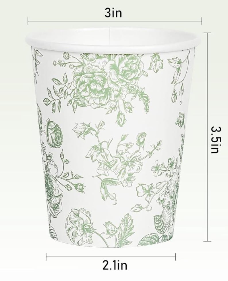 Op de afbeelding: Witte papieren beker met een groen bloemmotief. De beker heeft een diameter van 7,6 cm, is 8,9 cm hoog en heeft een diameter van 5,3 cm aan de basis. Het bloemmotief omvat rozen en andere bloemen.