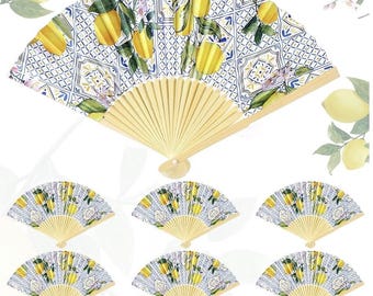 May include: A collection of decorative hand fans. The fans feature a lemon and floral design on a white and blue background. The fan's wooden frame is a light yellow colour.
