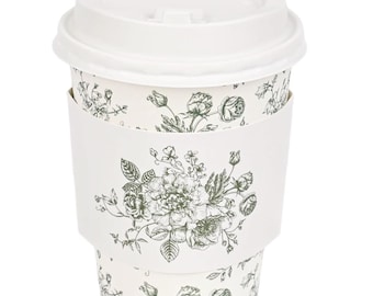 May include: A white disposable coffee cup with a lid and a floral print sleeve. The cup and sleeve feature a delicate green and white botanical design, suitable for hot drinks.