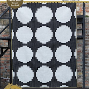 May include: A black and white quilt pattern called "Chromaflick Dot" with a geometric design of circles. The pattern is available in three sizes: baby (42 inches square), throw (60 inches by 78 inches), and bed (96 inches by 114 inches).