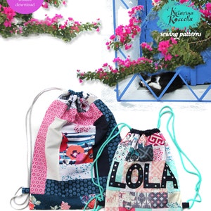 May include: Two colourful drawstring bags with patchwork fabric designs. The larger bag has a blue, white and pink design. The smaller bag has a multi-coloured patchwork design with the name "LOLA" in black letters. The bags are on a white background. The text "LOLA DRAWSTRING BAG" is at the top of the image.