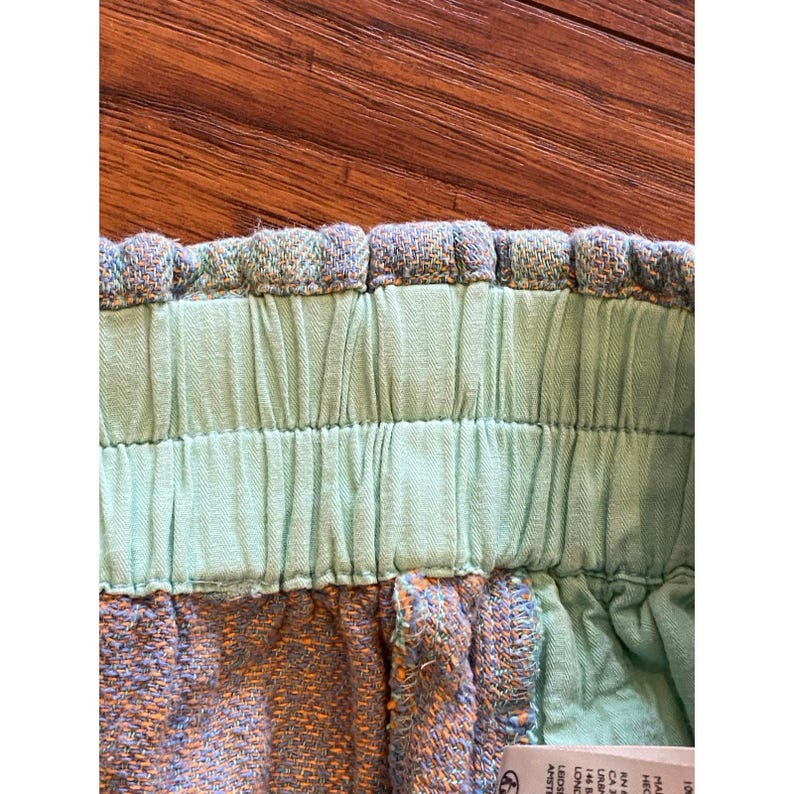 Pantalones cortos Free People Solar Flare Baja a rayas verdes y azules, talla M, estilo bohemio. imagen 10