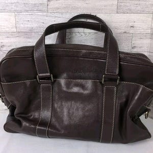 Cartera multicompartimentos grande de cuero marrón oscuro de COLE HAAN, bolso de mano para hombre