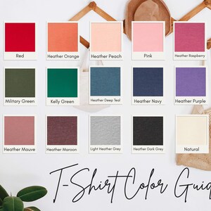 a color guide for t-shirt colors, featuring twelve different color swatches arranged in a grid. The swatches include various shades of red, orange, peach, pink, raspberry, navy, purple, green, teal, navy blue, gray, maroon, light grey, dark grey, and natural.