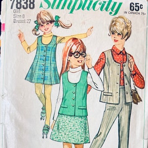 May include: A vintage sewing pattern for girls' clothing. The pattern includes three different outfits: a green vest and skirt, a plaid dress, and a striped vest and pants. The pattern is from Simplicity and is number 7838. The pattern is for size 8 and a 27 inch bust.