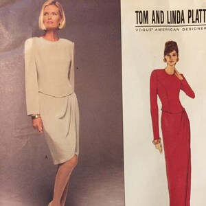 May include: Vogue American Designer pattern featuring two dress designs. One dress is a light beige, long-sleeved design with a draped skirt. The other is a long, red, long-sleeved dress with a draped skirt. The pattern includes sizes 8 and 10.