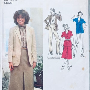 May include: A sewing pattern for a junior size skirt and blazer. The pattern includes two sizes, 13 and 15. The pattern is from Simplicity and the pattern number is 9086.