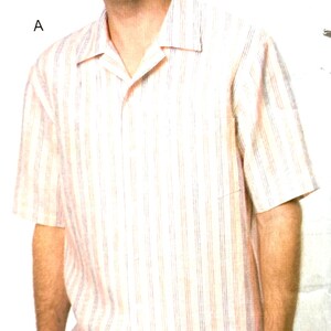 May include: A short-sleeved, button-down shirt with vertical stripes in shades of peach, white, and blue. The shirt has a relaxed fit and a single chest pocket. The model is wearing the shirt with dark blue jeans.