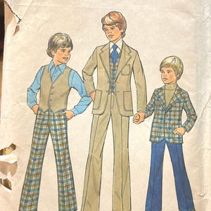 May include: A vintage sewing pattern for boys' clothing. The pattern shows three boys wearing different styles of trousers and jackets. The pattern is for size 6, child and boy. The pattern is from Simplicity.