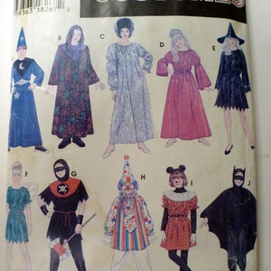 May include: A Simplicity sewing pattern for making ten different children's costumes. The costumes include a wizard, a witch, a fairy, a pirate, a clown, a mouse, a bat, a princess, a medieval maiden, and a ghost. The pattern is for sizes small, medium, and large.