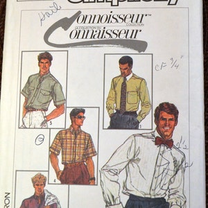 May include: A sewing pattern for men's shirts, featuring five different styles. The pattern is from Simplicity and is part of the Connoisseur collection. The pattern number is 7015.