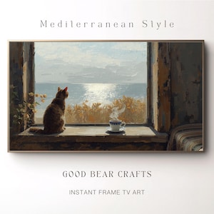 Puede incluir: Impresión artística digital enmarcada que representa un gato mirando por una ventana un paisaje marino. Una taza de café está en el alféizar. Se ven las palabras "Mediterranean Style" y "GOOD BEAR CRAFTS INSTANT FRAME TV ART".