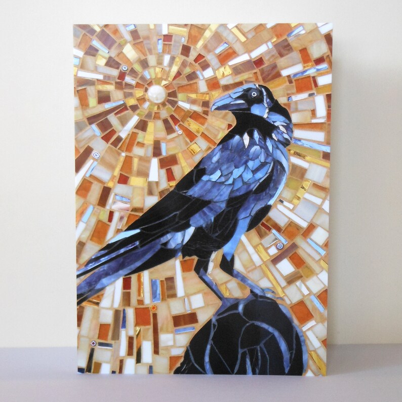 May include: A mosaic artwork depicting a blue crow perched on a rock. The background is a circular pattern of brown, orange, and white tiles.