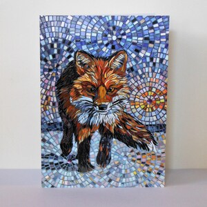 May include: A mosaic artwork of a red fox walking on a blue and white background. The fox is made of small glass tiles and has a detailed face.