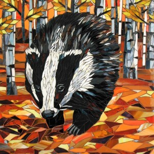 May include: A mosaic artwork depicting a badger walking through a forest of birch trees. The badger is black and white with a white stripe down its face. The trees are white with brown bark and yellow leaves. The ground is covered in orange, brown, and yellow leaves.