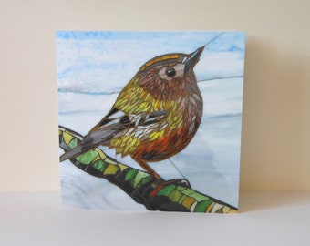 May include: A mosaic art card featuring a small, brown, yellow, and orange bird perched on a branch. The bird has a long, thin beak and a round body. The background is a light blue sky with white clouds.