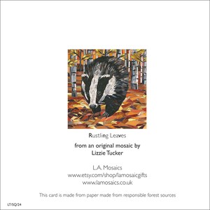 May include: A mosaic art card featuring a badger walking through a forest of autumn leaves. The card is titled "Rustling Leaves" and is from an original mosaic by Lizzie Tucker.