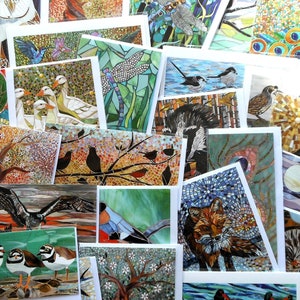 May include: Assortment of greeting cards featuring mosaic artwork of various animals, including owls, peacocks, birds, foxes, and more. The cards are printed on white cardstock and have a glossy finish.