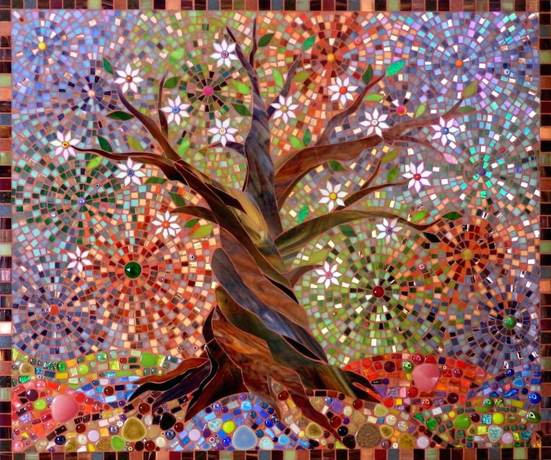 May include: A mosaic artwork depicting a stylised tree with white flowers and a brown trunk. The background is a colourful mosaic of various shapes and sizes.