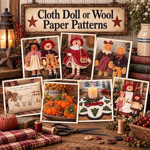 May include: A collection of craft patterns featuring cloth dolls, sheep-themed pillows, fabric pumpkins, and seasonal decor. The display includes a sign reading Cloth Doll or Wool Paper Patterns, alongside sewing supplies like scissors and thread spools.