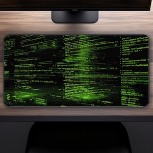 May include: Black and green computer mouse mat with a digital code design. The mat features a matrix of green text and symbols against a black background, creating a tech-inspired aesthetic. Suitable for gamers or programmers.