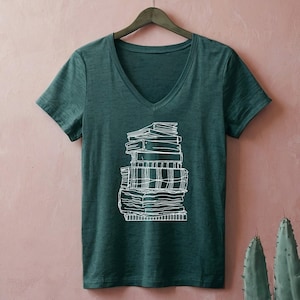 May include: A set of three ceramic mugs with a speckled, matte finish. The mugs are in shades of cream, light gray, and dark gray. Each mug has a simple, minimalist design, perfect for coffee or tea.