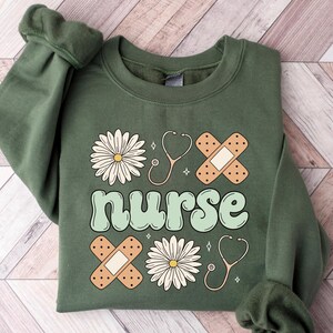 Cute Nurse Sweatshirt, Spring Nurse Sweatshirt, Nurse Graduation Gift, Nursing School Shirt, Soft Girl Nurse Crewneck, New Nurse Gifts Shirt