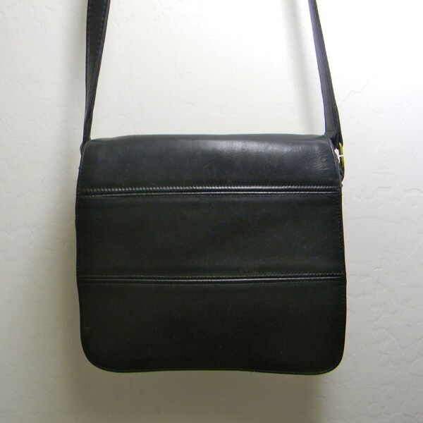 Vintage  black leather bag by coach, shoulder strap, flap and zipper