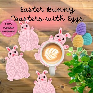 May include: Four pink crocheted Easter bunny coasters with a cup of coffee on one of them. There are also three crocheted Easter eggs in pastel colors.
