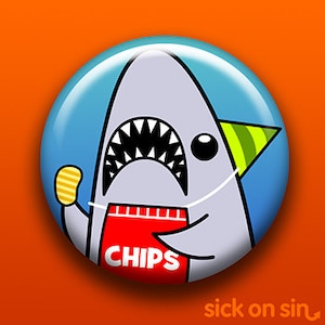 May include: A grey cartoon shark wearing a red apron with the word "CHIPS" on it. The shark is wearing a green party hat and holding a yellow chip in its fin.