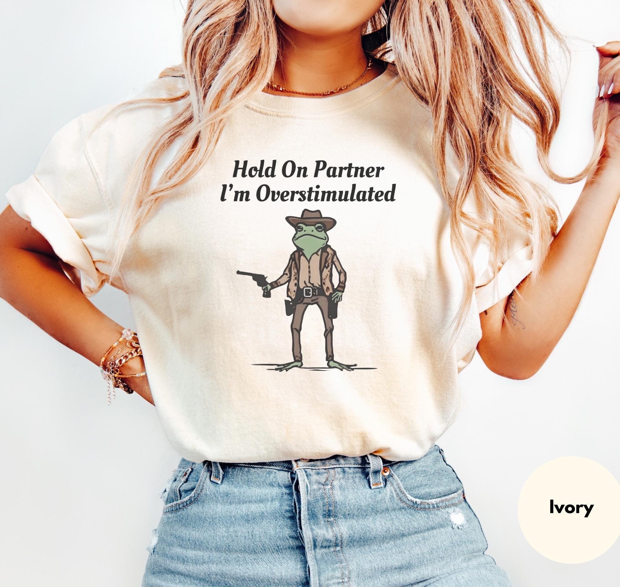 Hold On Partner Im Overstimulated Shirt Comfort Colors® Cowboy Frog T-Shirt | Funny Meme Shirt With Trending Quotes In Vintage design Style