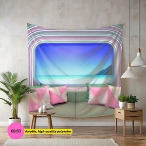 May include: A rectangular wall tapestry featuring a printed view of a beach through a rounded window frame with horizontal stripes in shades of purple, gray, and teal. The tapestry is made of polyester and measures 60 by 50 inches in size.