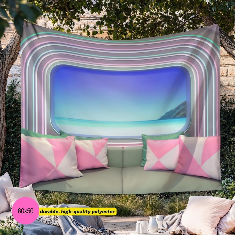 May include: A rectangular wall tapestry featuring a central window-like view of a calm blue ocean and sky, framed by concentric pastel-colored stripes in shades of pink, teal, and gray. The design includes a sofa with pink and white pillows.