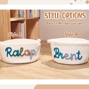 Puede incluir: Dos cestas de cuerda blanca con asas. El estilo A presenta el nombre Ralap en letras de lana multicolor. El estilo B presenta el nombre Brent en letras de lana azul y azul claro con un borde trenzado. El texto dice STYLE OPTIONS.