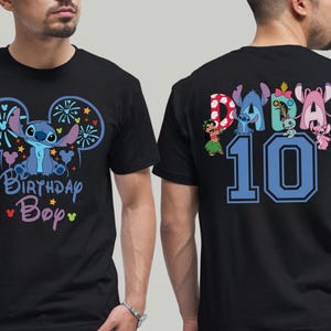 May include: Black t-shirt featuring a blue cartoon character with large ears and the text "Birthday Boy". The back of the shirt has the word "Daddy" and the number "10" with cartoon characters.