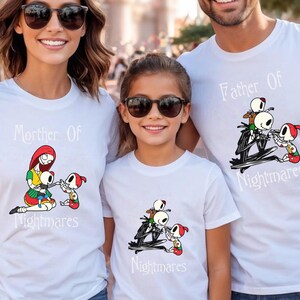 May include: White t-shirts with matching graphics and text. The shirts feature characters from The Nightmare Before Christmas. The text on the shirts reads "Mother of Nightmares" and "Father of Nightmares".