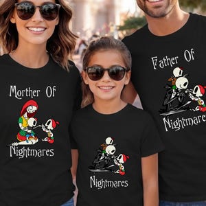 May include: Black t-shirts with matching graphics featuring characters from The Nightmare Before Christmas. The shirts read "Mother Of Nightmares", "Father Of Nightmares", and "Nightmares". The graphic includes Jack Skellington and Sally.