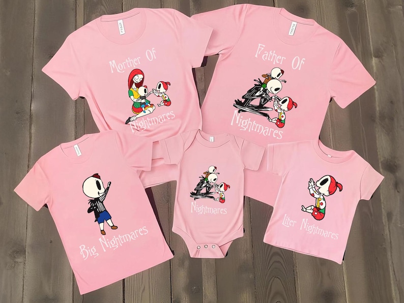 May include: Pink t-shirts and a onesie featuring characters from The Nightmare Before Christmas. The shirts have the phrases "Mother Of Nightmares", "Father Of Nightmares", "Big Nightmares", and "Little Nightmares". The onesie says "Nightmares".