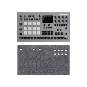 May include: A gray Elektron Analog Rytm MKII drum machine with numerous buttons, knobs, and a display screen. Below it is a gray felt cover with cutouts for the machine's controls. The text "Analog Rytm MKII" is visible on the machine.