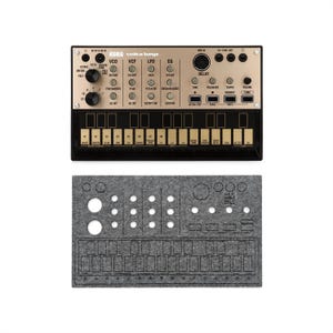 May include: A black and gold Korg Volca Keys synthesizer with numerous knobs and buttons, including VCO, VCF, and LFO controls. Below it is a gray felt cover with cutouts for the controls. The synthesizer has a keyboard with gold keys.