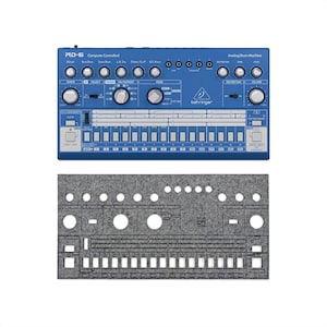 May include: A blue RD-6 Computer Controlled Analog Drum Machine with numerous knobs, buttons, and sliders. The text "RD-6" and "Behringer" are visible. Below is a gray felt cover with cutouts for the machine's controls.