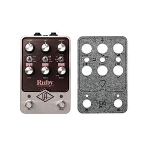 May include: A silver and brown guitar pedal with the text "Ruby Top Boost Amplifier" and "UA" logo. The pedal has knobs for volume, cut, output, speaker, silver, blue, green, mode, depth, symmetry, map, tone, speed, bass, treble, on, boost, and preset. A gray felt pedalboard with cutouts for pedals and the text "Master" is also shown.