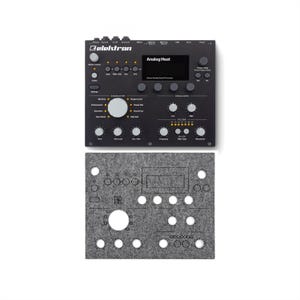 May include: Black Elektron Analog Heat sound processor with knobs, buttons, and a display screen. The text "Analog Heat" is visible on the screen. Below it is a gray felt panel with cut-out holes and shapes.