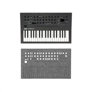 May include: A black Korg minilogue xd synthesizer with white and black keys, and a gray felt cover. The synthesizer has numerous knobs and buttons. The felt cover has cutouts for the controls and keys.