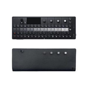 May include: A black and silver electronic music synthesizer with a small screen and a grid of buttons. The synthesizer is labeled "MXY". A black leather case with five buttons is also shown.