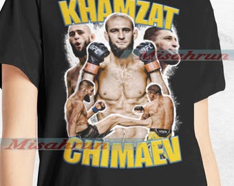 May include: Black t-shirt with a graphic of mixed martial arts fighter Khamzat Chimaev. The graphic features a collage of images of Chimaev in different fighting poses, with the text "Khamzat Chimaev" in yellow letters.