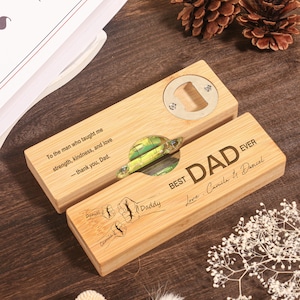 May include: A wooden bottle opener with a metal opener and a decorative green and yellow design. The opener is engraved with the words "BEST DAD EVER" and a message. A gift for Father's Day.