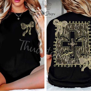 May include: Black t-shirt featuring a gold bow on the front and a camouflage cross design on the back. The back graphic includes antlers, a fish, and a fishing hook. The word "Thud" is printed on the front.