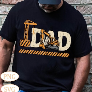 May include: Black t-shirt featuring a graphic of a construction crane and an excavator with the word "DAD" in a distressed font.
